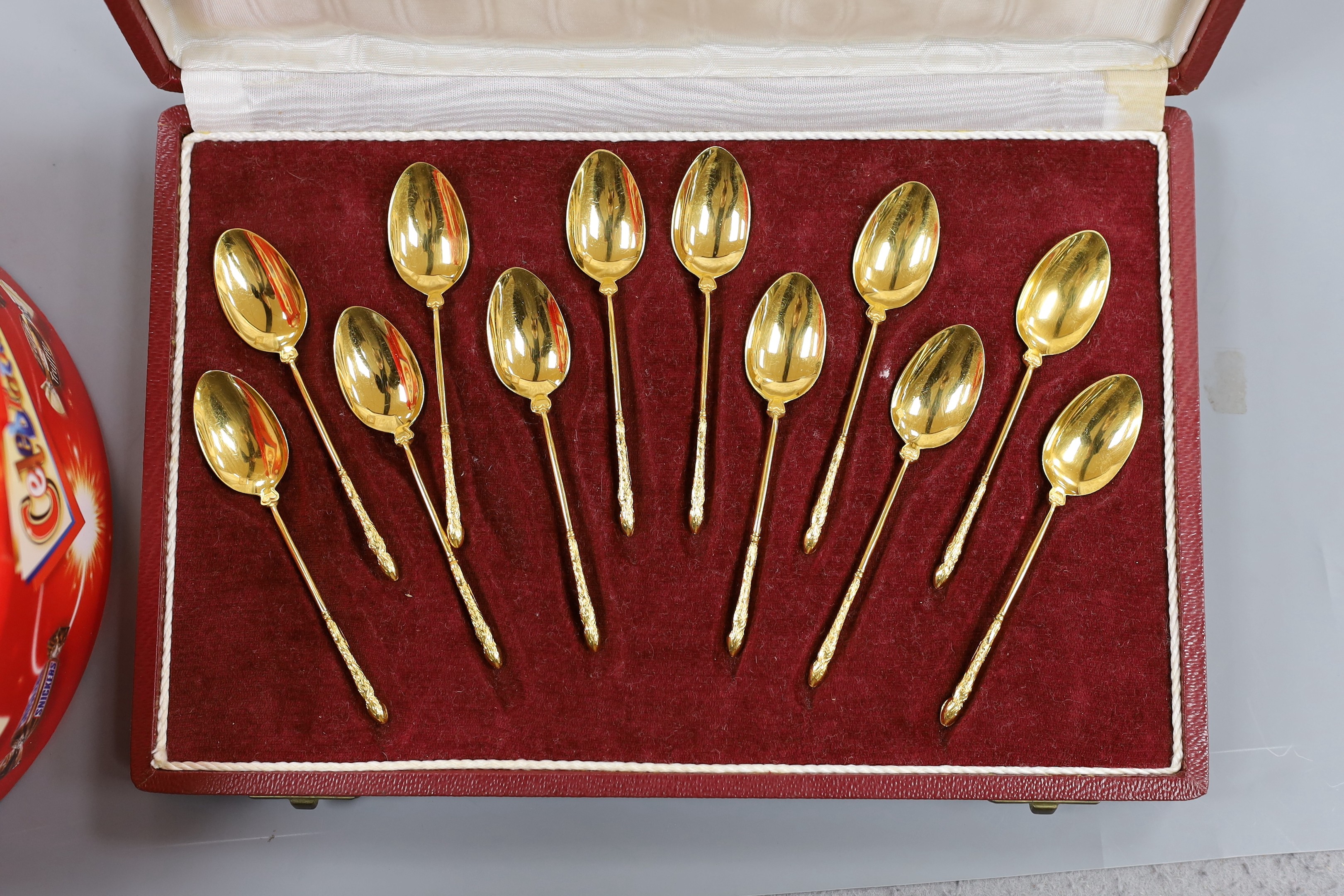 Assorted jewellery including enamelled silver bracelet, other white metal items, costume jewellery, agate necklace and a cased set of French gilt spoons.